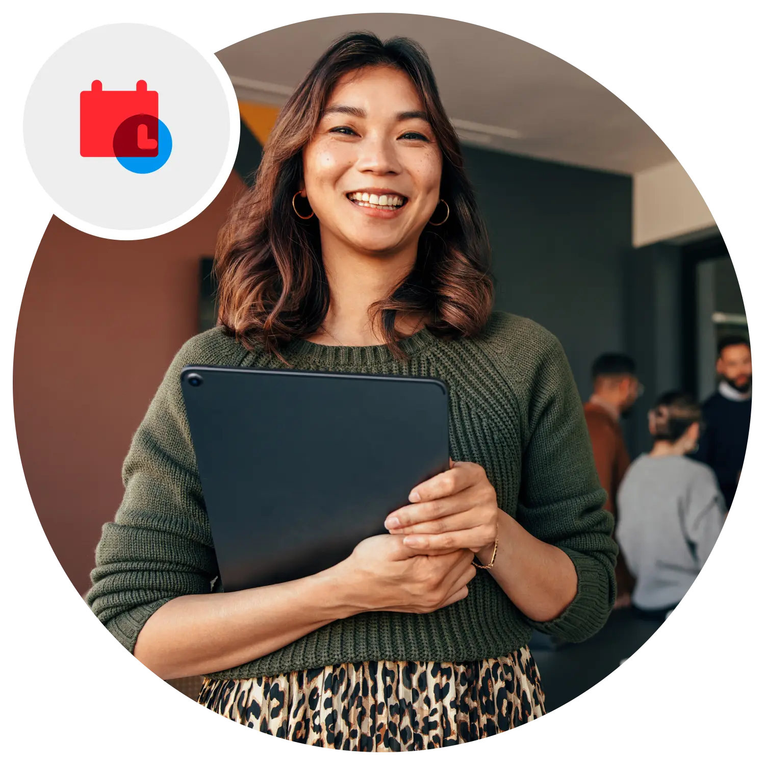 Woman holding a tablet.
