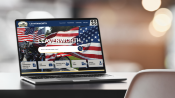 Laptop displaying the website homepage of Leavenworth